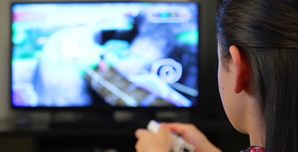 Teenage Girl Playing Video Games on Smart TV