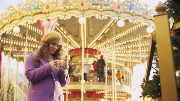 Woman with Curly Hair Enjoys Festive Fair