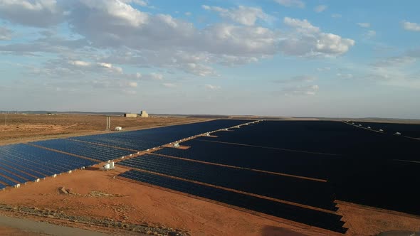 Drone view over a giant solar energy farm