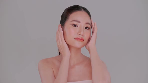 Portrait of Asian young woman with soft make-up and white skin.