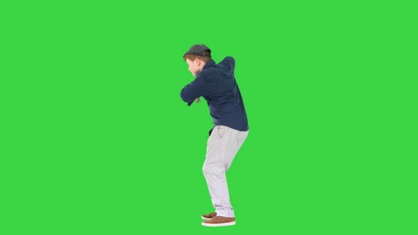 Happy Stylish Boy Doing Some Cool Dancing on a Green Screen Chroma Key