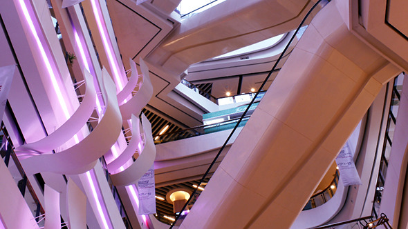 Crowd of Shoppers on Escalator in Shopping Mall alt