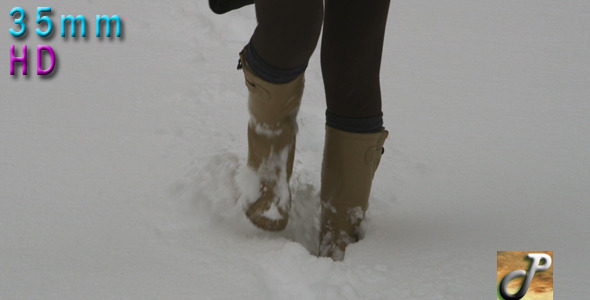 Woman Walking Outdoor In Snow