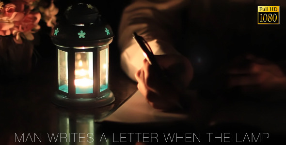Man Writes A Letter When The Lamp