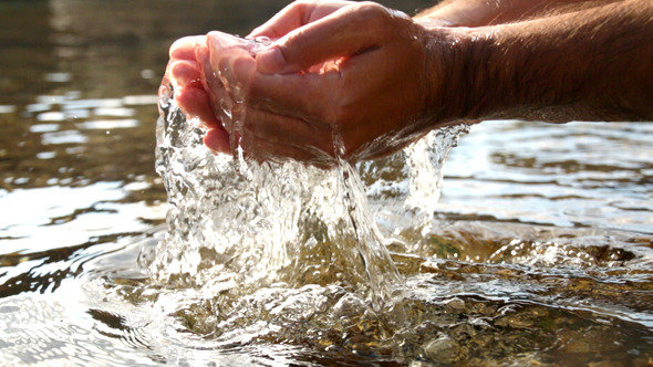 Collecting Water with Hands in the Sea