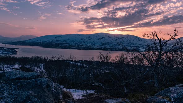 A time lapse of the sun setting as seen from the island of Tromsøya with sand particles from Sahara