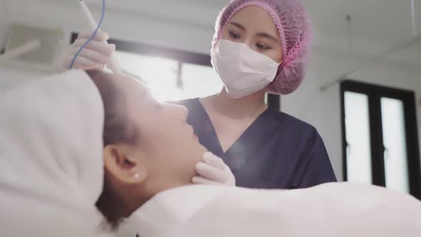 Beauty clinic concept. Young woman getting professional facial procedure.