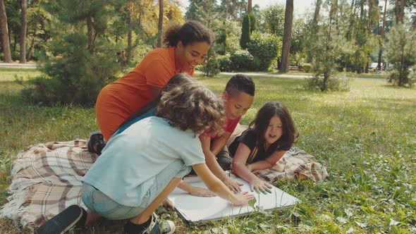 School Children Creativity During Outdoor Lesson in Public Park