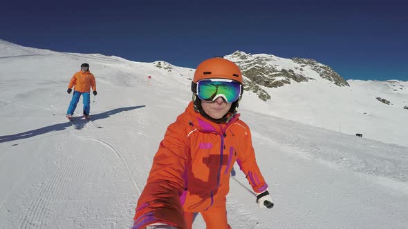 Friends Skiing Down Empty Ski Slope