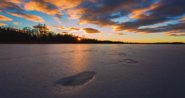 Timelapse of Frozen Lake at Sunset Light in Lithuania