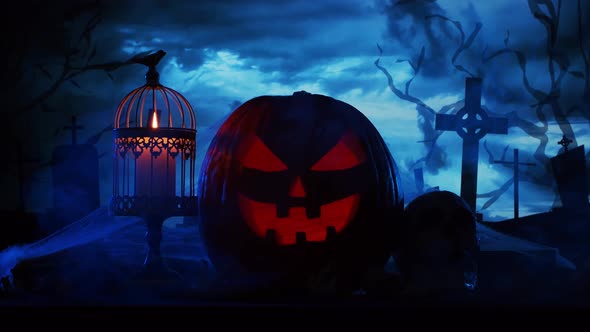 Scary laughing pumpkin and an old skull over the frightening gothic background.