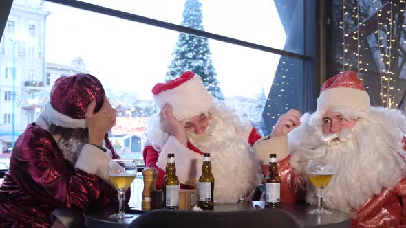 Three Santa Clauses are Resting in a Cafe They Met After a Hard Day's Work