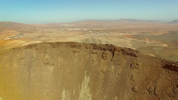 Aerial view of an arid landscape at Caldera de Gairia volcano in Fuerteventura.