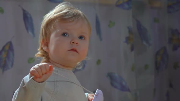 Baby Grabs a Computer Mouse