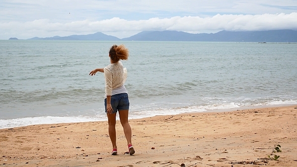 Female Walking on The Beach