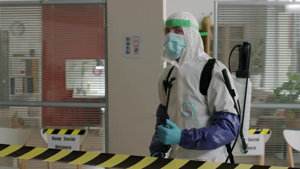 Man in Protection Costume Turning Around