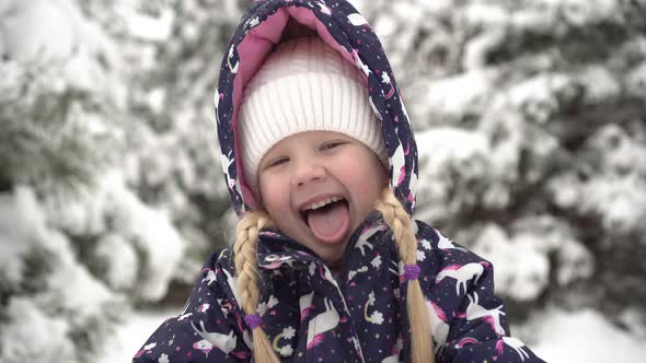 Happy Baby Girl Outdoors in Winter