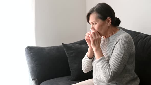 A Senior Woman Feels Sick at Home