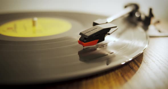 Record rotates on a retro wooden turntable - Slow camera panning