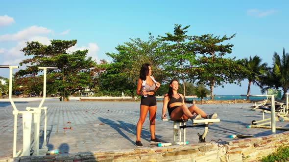 Girls tan on paradise island beach journey by blue sea with white sand background of Koh Phangan in 