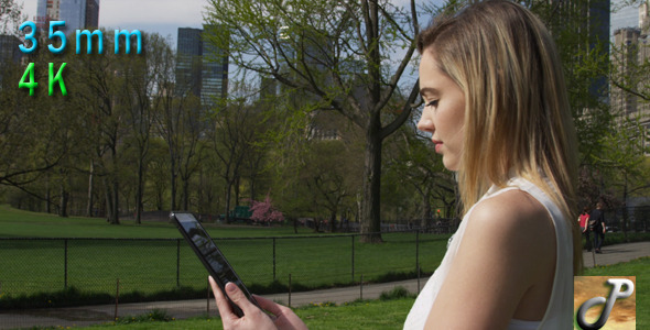 Woman With Tablet In Central Park