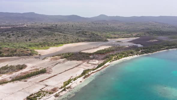 Turquoise Blue Water With Sweeping Forest Landscape At Playa La Ensenada At Summer In Dominican Repu