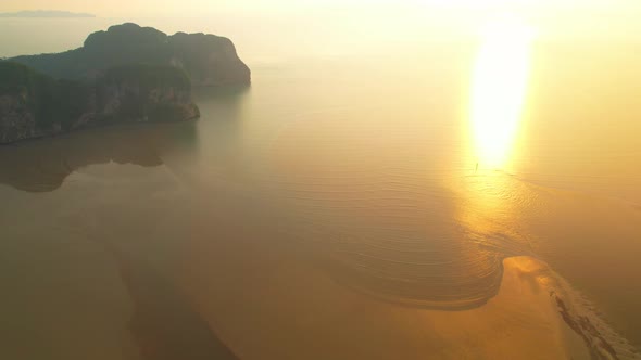 Aerial view over the coast, mountains and beaches during beautiful sunsets