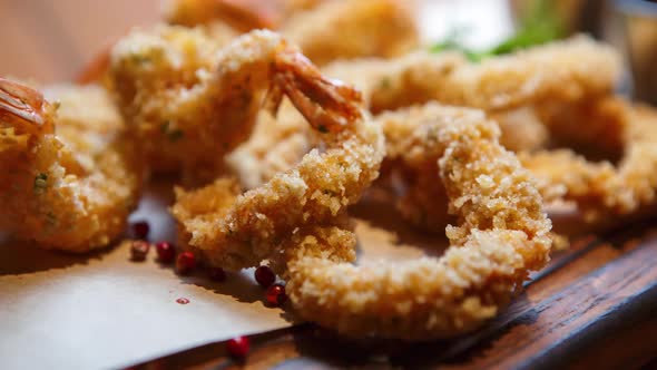 Crunchy shrimps prepared in deep fryer oven in bar