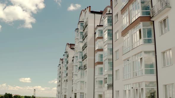 Aeria Drone Viewl of a Tall Residential Apartment Building with Many Windows and Balconies