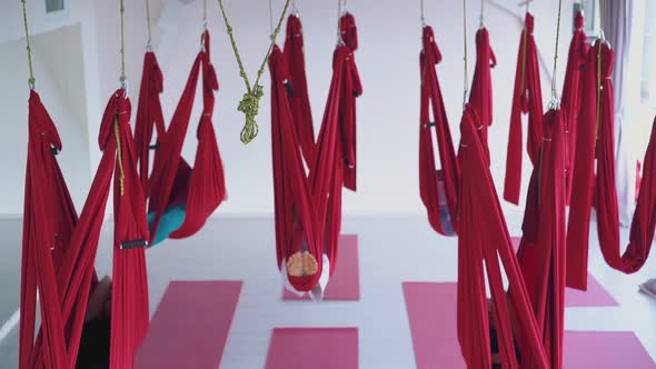 Fly Yoga Class with Ladies Recovering Energy in Hammocks