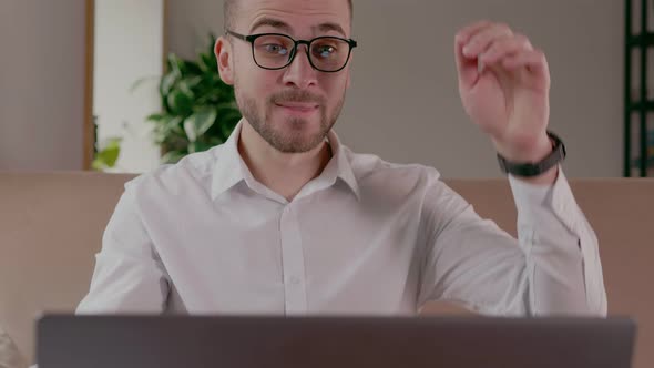 Young Male Businessman Celebrating a Victory