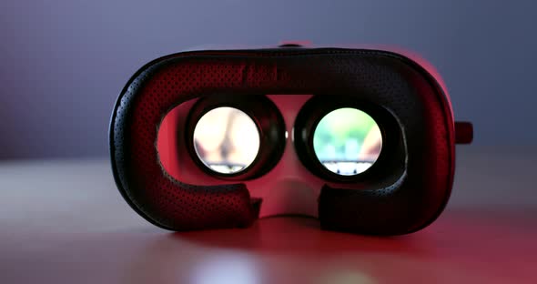 Virtual reality device playing video inside with red light at the back