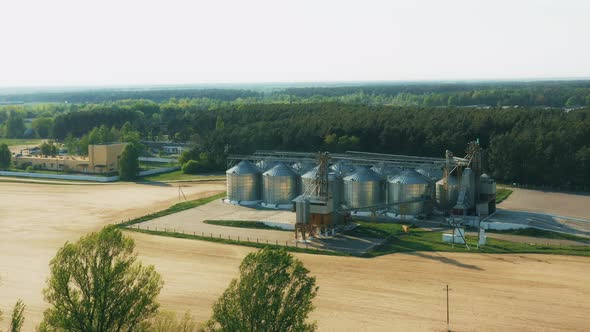 Aerial Elevated Top View Modern Granary Graindrying Complex Commercial Grain Or Seed Silos In Sunny