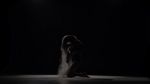 Professional Dancer Throwing Dust Particles in Air. Slow Motion