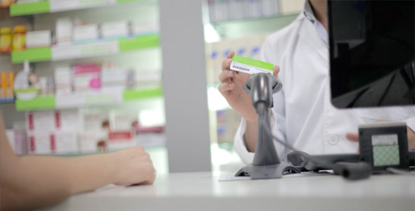 Pharmacist Serves Customer alt