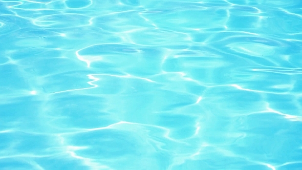 Sunlight Reflection in BlueSwimming Pool Water