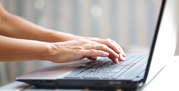 Hand Write on the Laptop Keyboard