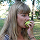Beautiful Girl Eating Pear in a Park - VideoHive Item for Sale