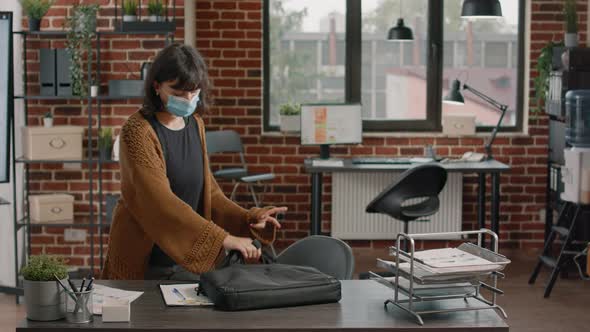 Employee Arriving at Startup Job and Preparing Laptop to Work