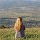 Girl Sitting on Top of the Hill Looking Far Away - VideoHive Item for Sale