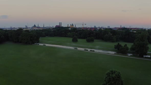 Foggy view at the popular Englischer Garten in the centre of Munich, flying forward and rising up at