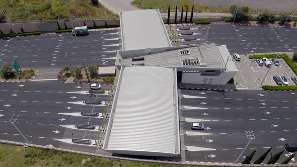 Time lapse of Traffic entering and leaving a toll road, Aerial view.