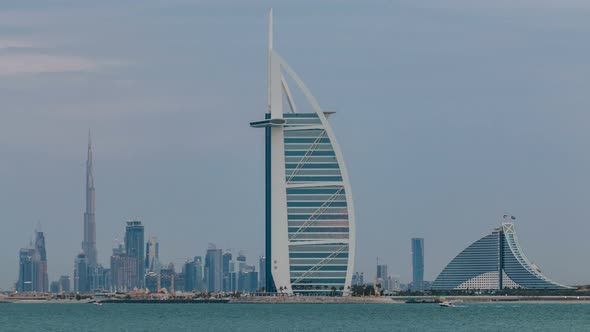 Dubai Skyline with Burj Al Arab Hotel During Sunset and Day to Night Timelapse