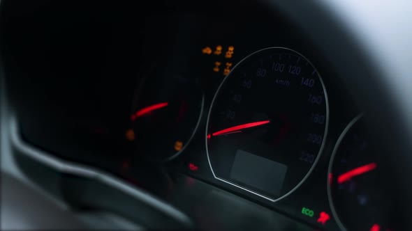 the car dashboard lights up with signal lights and then goes off