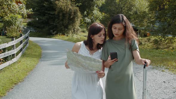 Tourists Girls Searching a Booking Address