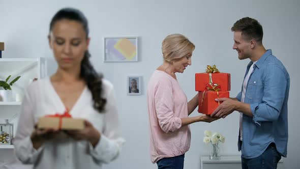 Wife Holding Small Gift Box Wife Husband Giving Mother Big Presents, Attention