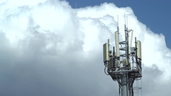 mobile communications tower against the sky. time lapse