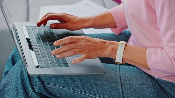 Close Up of a Mature Woman Using a Laptop