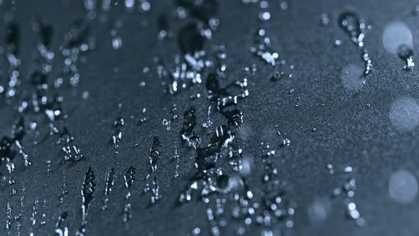 Super Slow Motion Shot of Water Splashing on Waterproof Cloth at 1000Fps