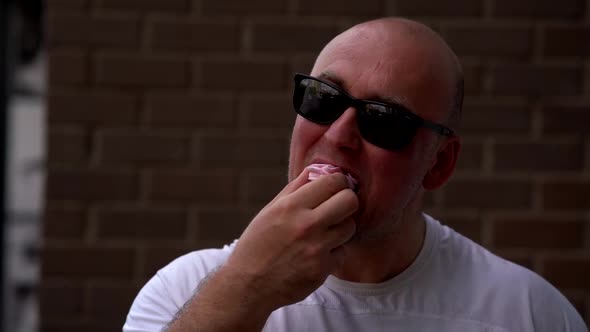 Funny Fat Man Is Eating Sweets and Licking Fingers and Rejoicing, Enjoy By Unhealthy Food